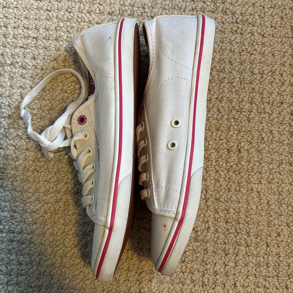 Never worn White vans with pink trim. Size 7